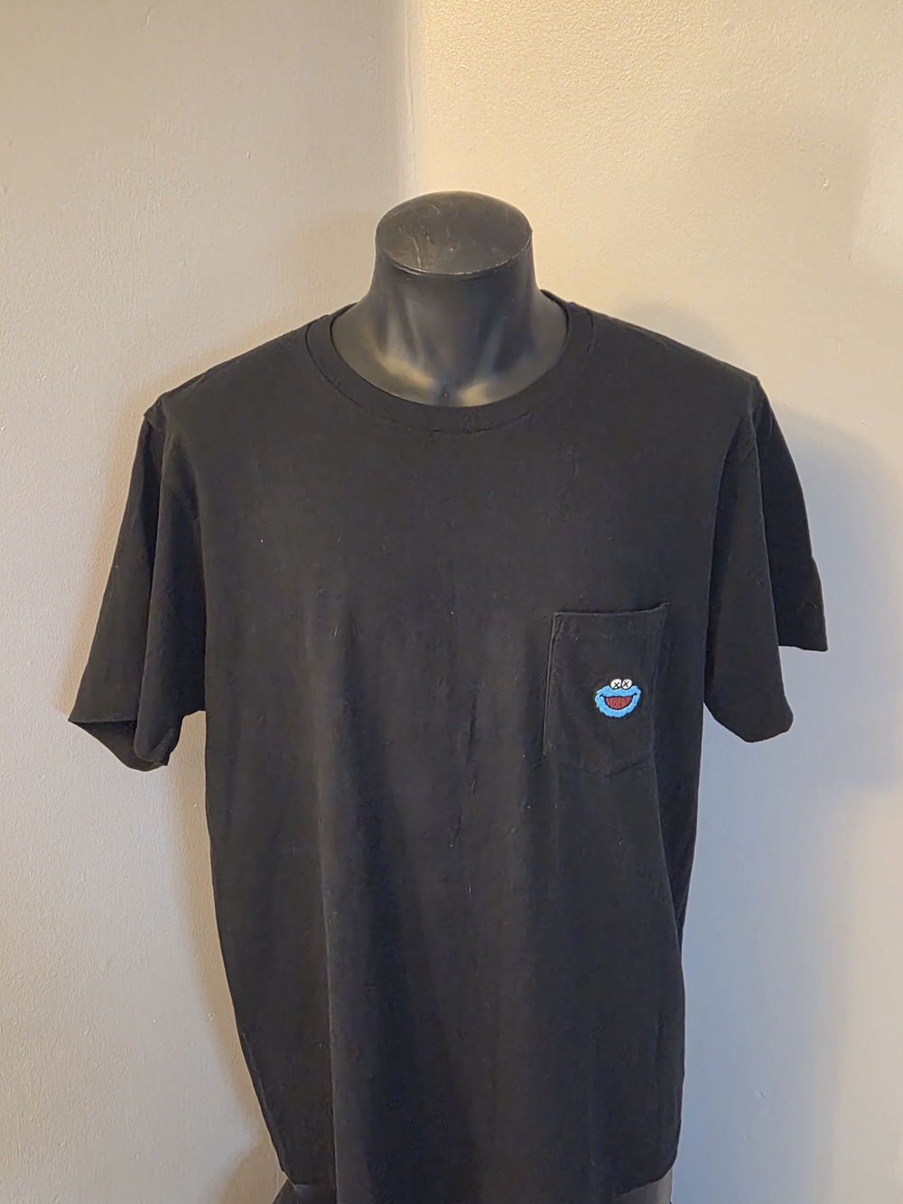 KAWS Black Short-Sleeve Pocket Tee with Blue Patch